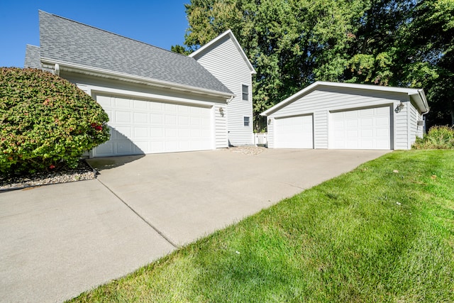 garage featuring a yard