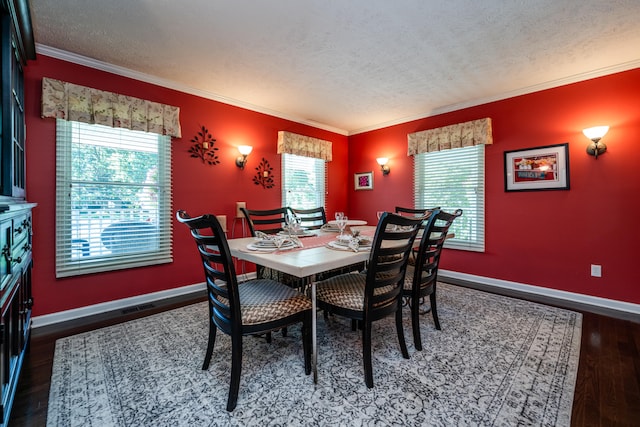 dining area featuring crown molding, hardwood / wood-style floors, and a textured ceiling