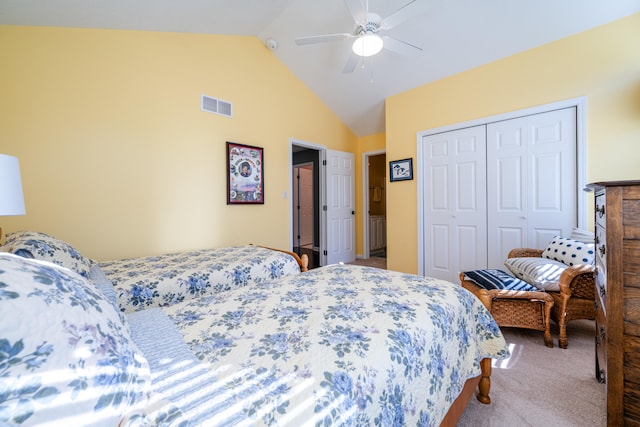 bedroom featuring lofted ceiling, a closet, carpet, and ceiling fan