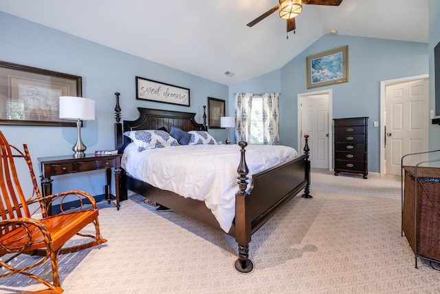 carpeted bedroom with vaulted ceiling and ceiling fan