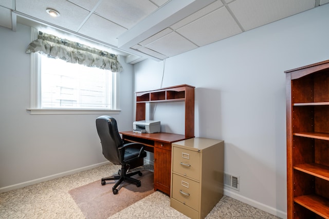 office area featuring a drop ceiling and light carpet