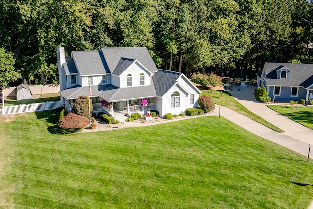 view of front of home featuring a front lawn and a porch