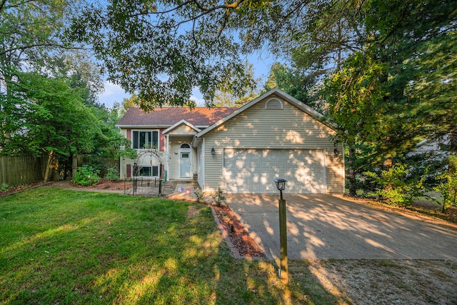 view of front of home with a garage and a front lawn