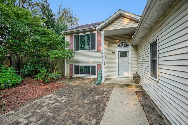 property entrance featuring a patio