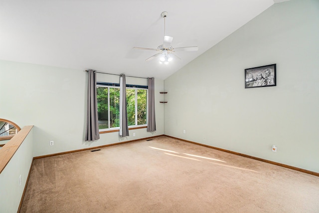 unfurnished room with lofted ceiling, ceiling fan, and carpet floors