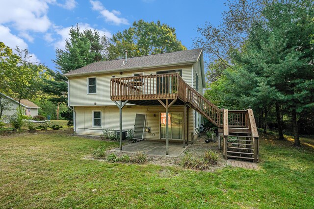 back of property with central AC, a yard, a patio, and a deck