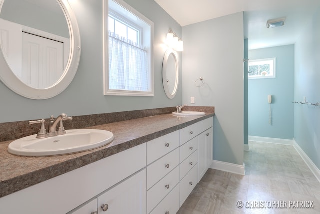 bathroom with vanity and plenty of natural light