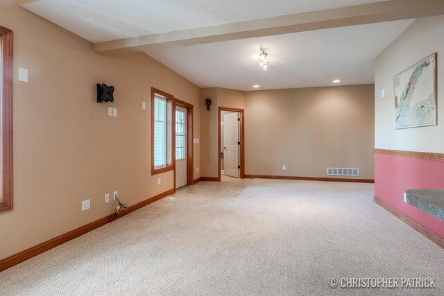 spare room with light colored carpet