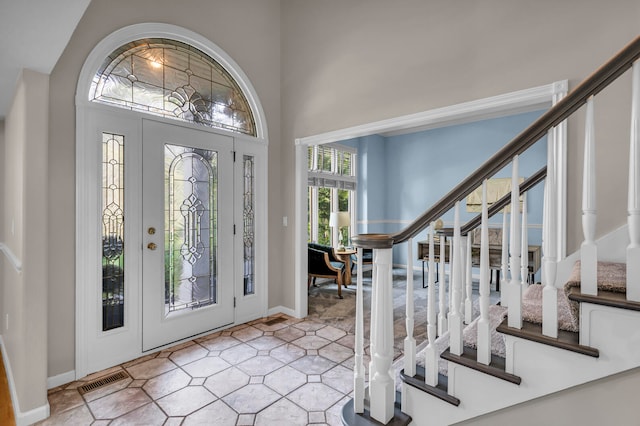 entrance foyer with a towering ceiling