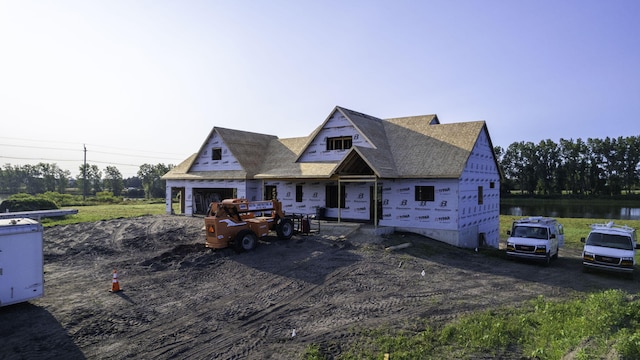 view of front of property featuring a water view