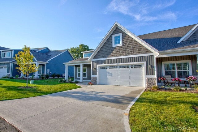 craftsman-style house with a front lawn and a garage