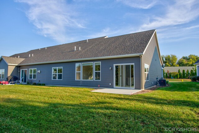 back of property featuring a yard, a patio area, and central air condition unit