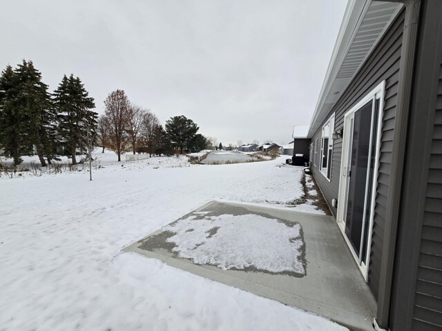 view of yard layered in snow