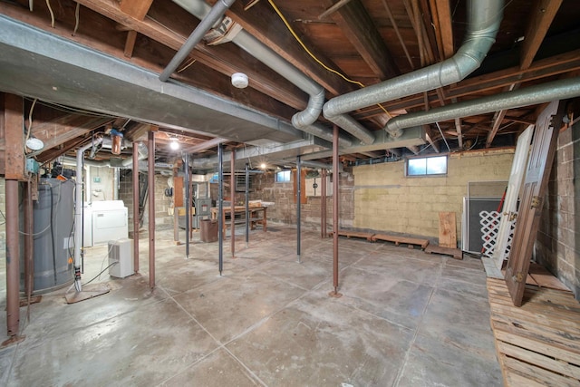 basement featuring washing machine and clothes dryer