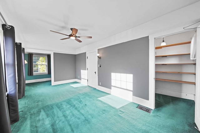 spare room with ceiling fan and carpet floors