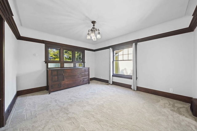 interior space featuring a chandelier and light carpet