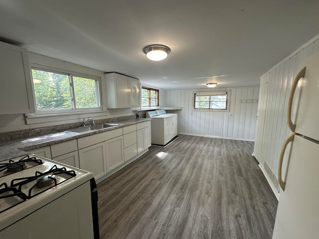 kitchen featuring dark wood-type flooring, white appliances, sink, and white cabinets