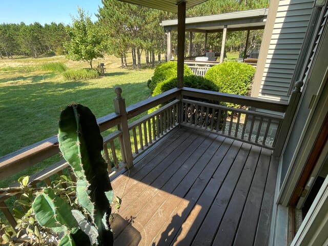 deck featuring a lawn