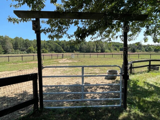 view of yard with a rural view