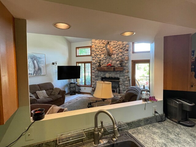 carpeted living room with a fireplace