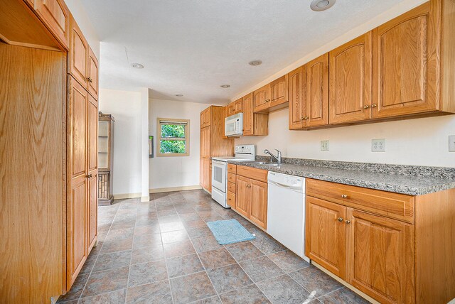 kitchen with white appliances and sink