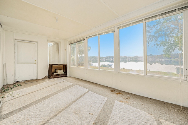 unfurnished sunroom with a water view and plenty of natural light