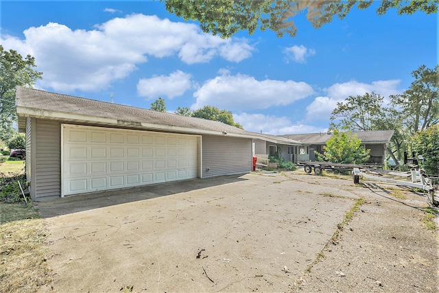 exterior space featuring an outdoor structure and a garage