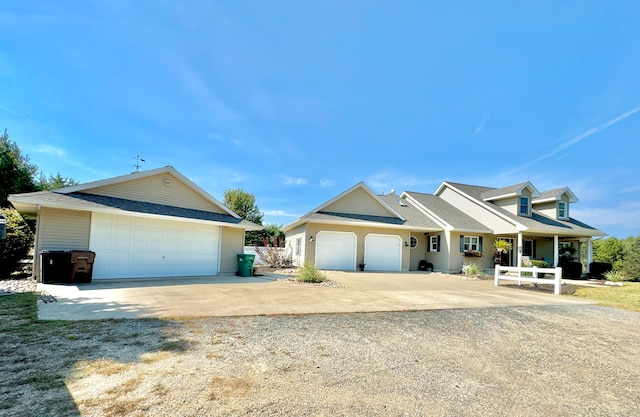 view of front of house featuring covered porch and a garage