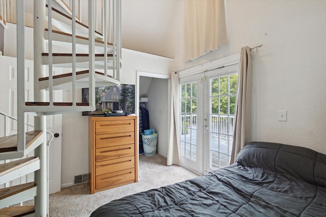 carpeted bedroom featuring french doors and access to exterior