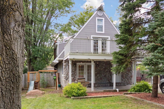 view of front of property with french doors and a front yard