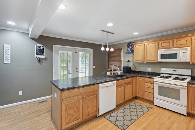 kitchen featuring white appliances, pendant lighting, light hardwood / wood-style flooring, kitchen peninsula, and sink