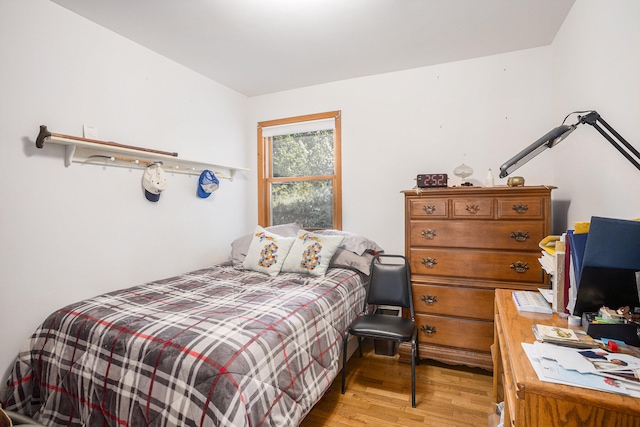 bedroom with light hardwood / wood-style floors