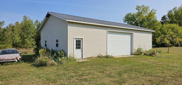 garage featuring a yard