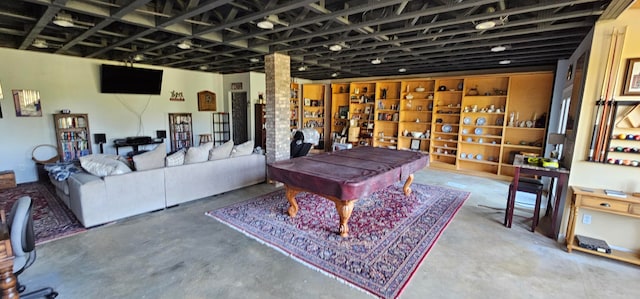 rec room with concrete floors and billiards