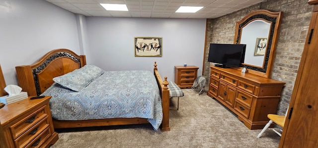 carpeted bedroom with a paneled ceiling