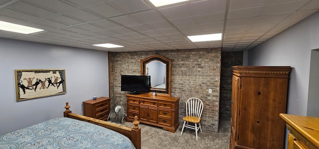 carpeted bedroom with a paneled ceiling