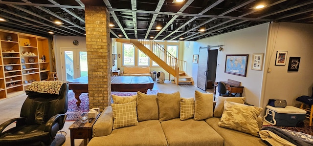 interior space with a barn door and french doors