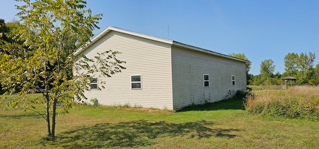 view of home's exterior featuring a yard