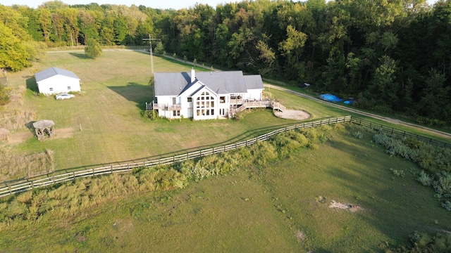 birds eye view of property with a rural view