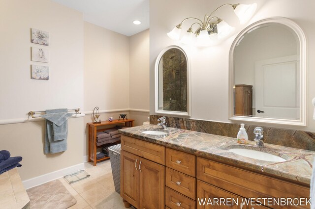 bathroom with tile patterned flooring and vanity