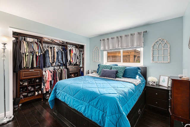 bedroom featuring a closet and dark hardwood / wood-style flooring