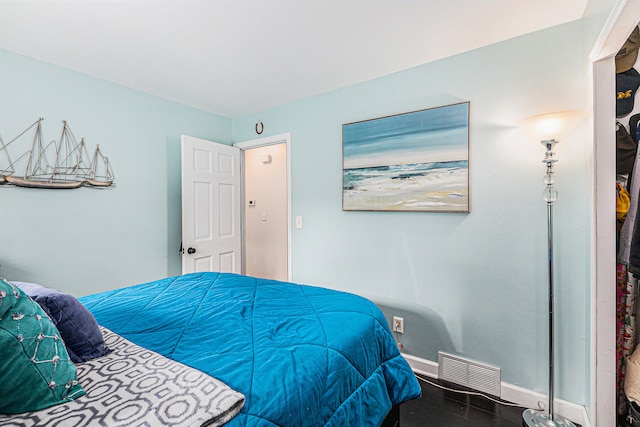 bedroom with wood-type flooring