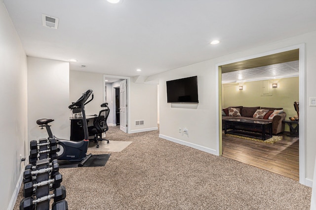 workout area featuring hardwood / wood-style flooring