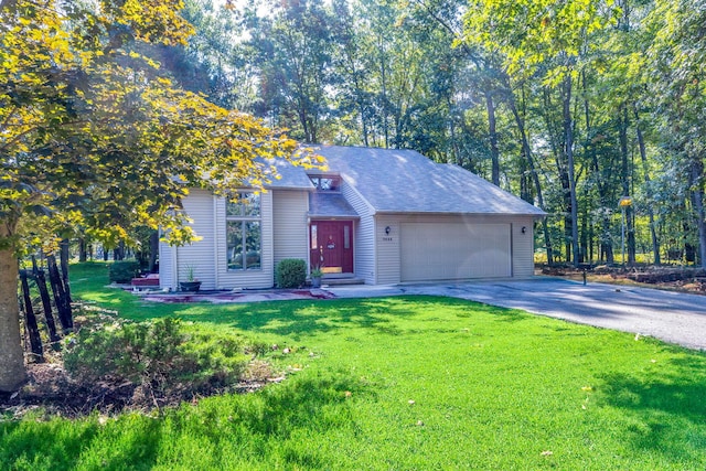 ranch-style house featuring a front lawn and a garage