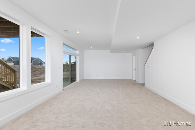 spare room with light colored carpet