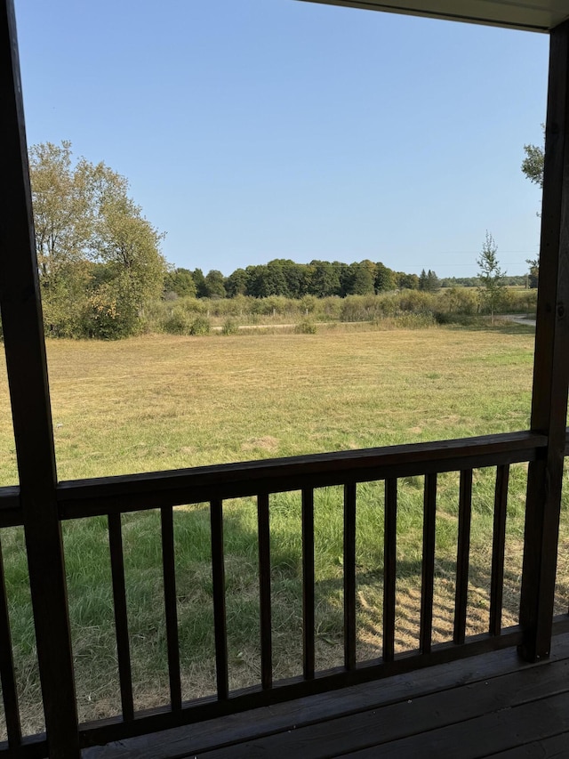 view of yard with a rural view