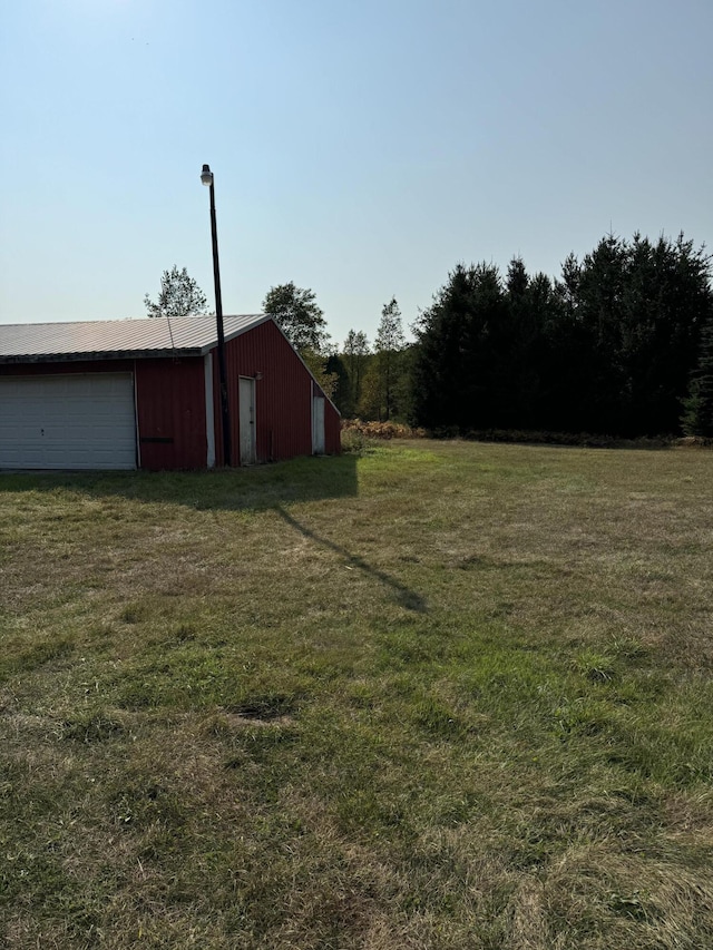 view of yard with a garage