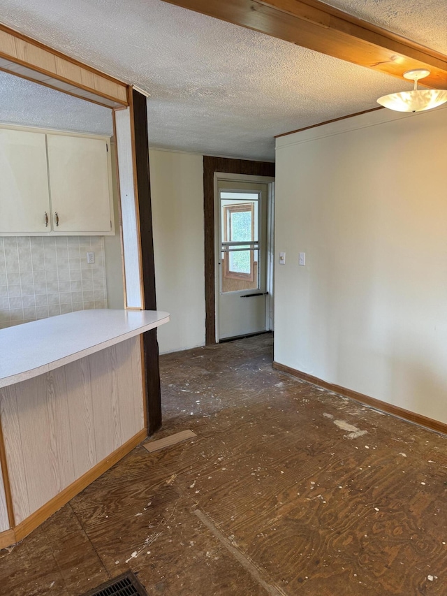 interior space featuring a textured ceiling