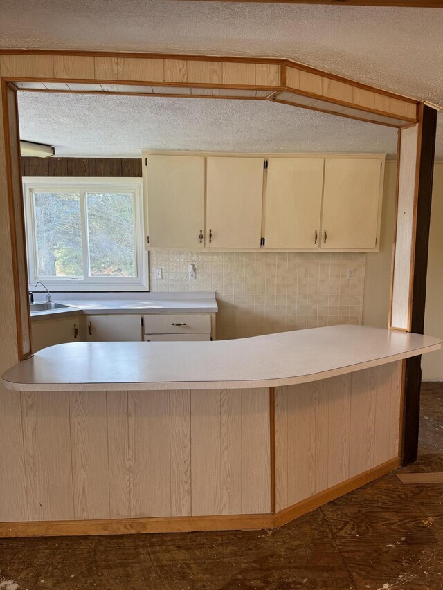 kitchen with cream cabinetry and sink