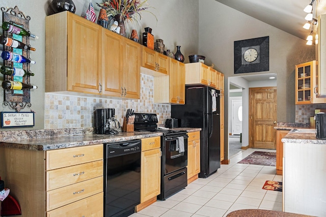 kitchen featuring black appliances, light tile patterned floors, light brown cabinets, decorative backsplash, and lofted ceiling